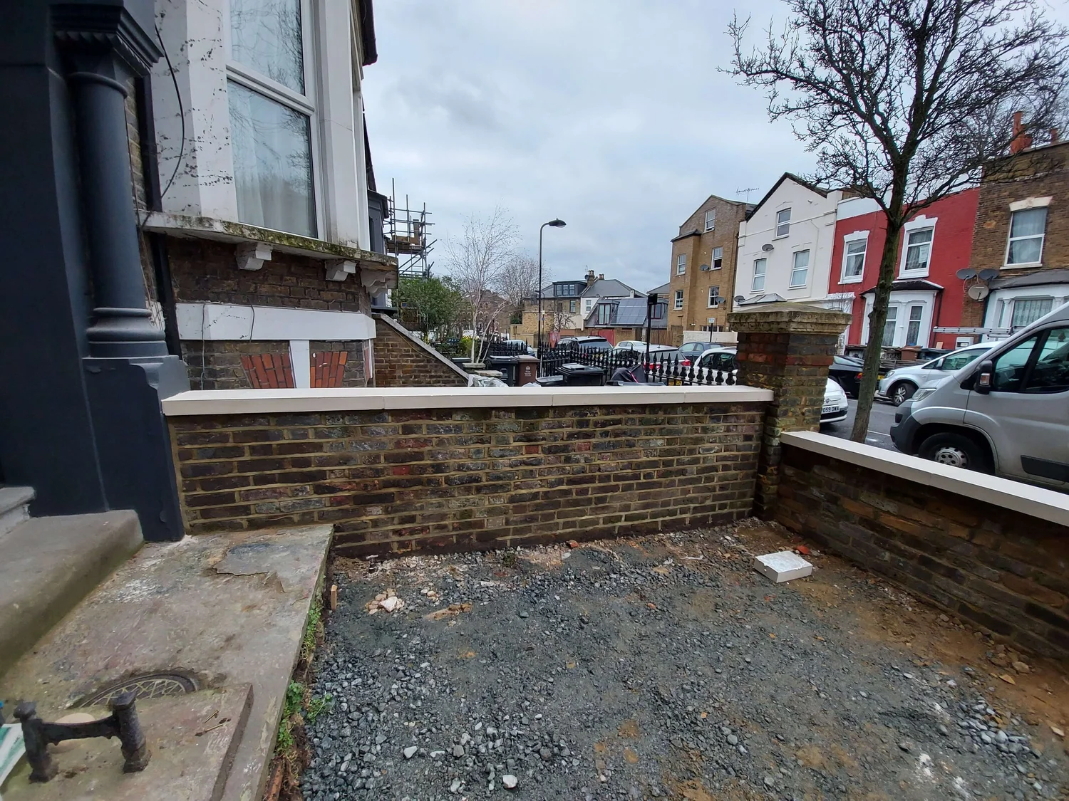Restored brick wall side view showing the complete restoration work
